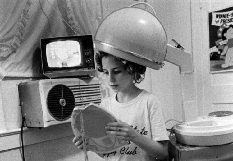 Woman sitting under Leslie hair dryer