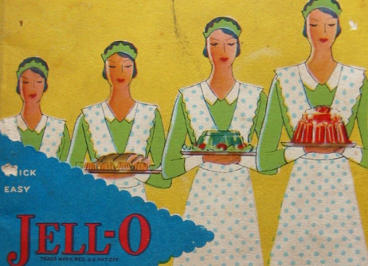 Four women dressed in green with green polka dot aprons