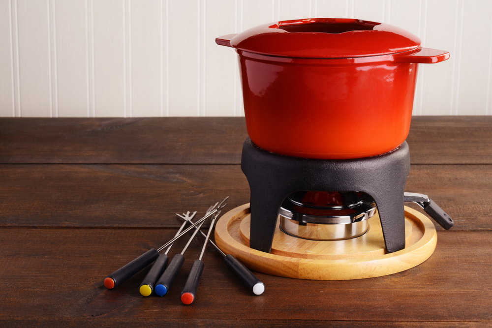 Red cast iron fondue pot