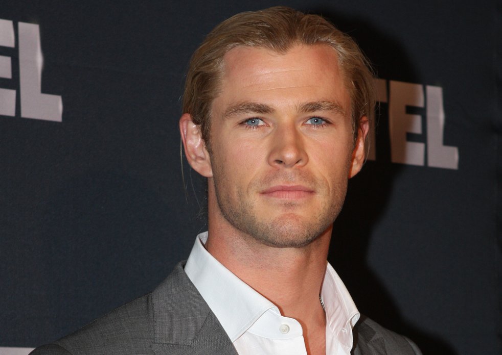 Chris Hemsworthwith long hair and wearing white shirt