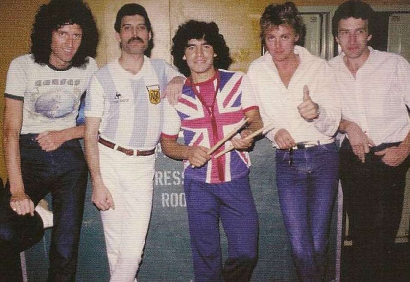The members of Queen meet with the soccer player Diego Maradona