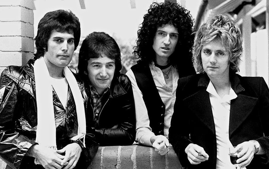 From left to right; Freddie Mercury, John Deacon, Brian May, and Roger Taylor