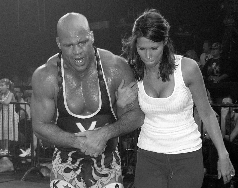 Kurt Angle being dragged and helped by his then-wife Karen Angle