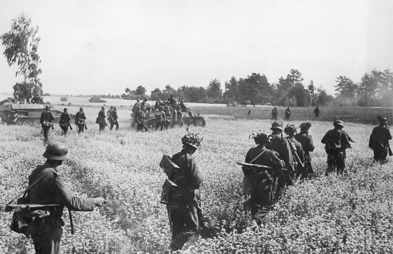 German mechanized forces pushing east through a rapeseed field