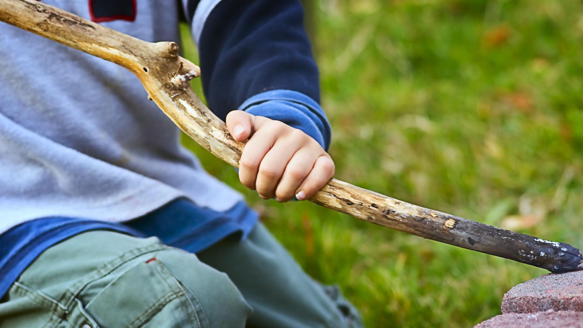 File:Boy gripping stick.jpg