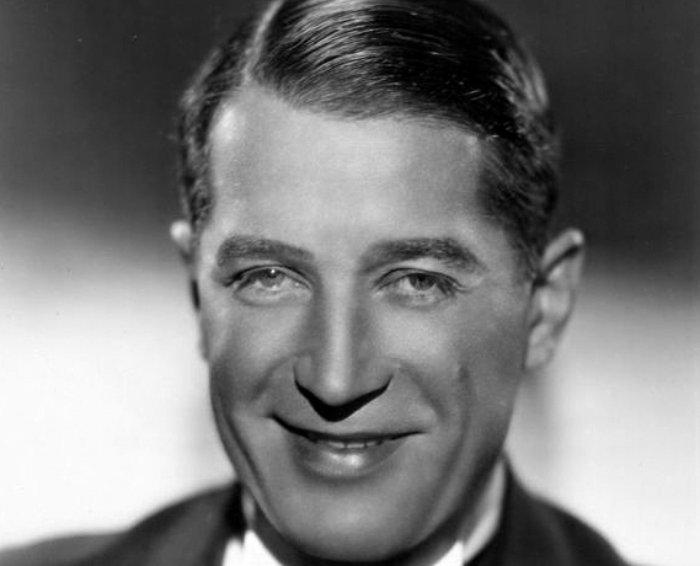 Grayscale Portrait Photo of French singer an actor Maurice Chevalier