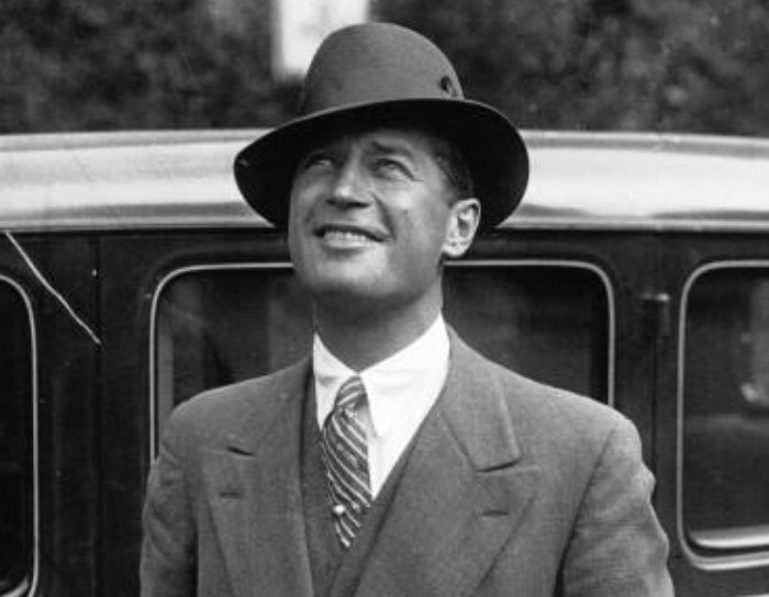 Grayscale Portrait Photo of French singer and actor Maurice Chevalier