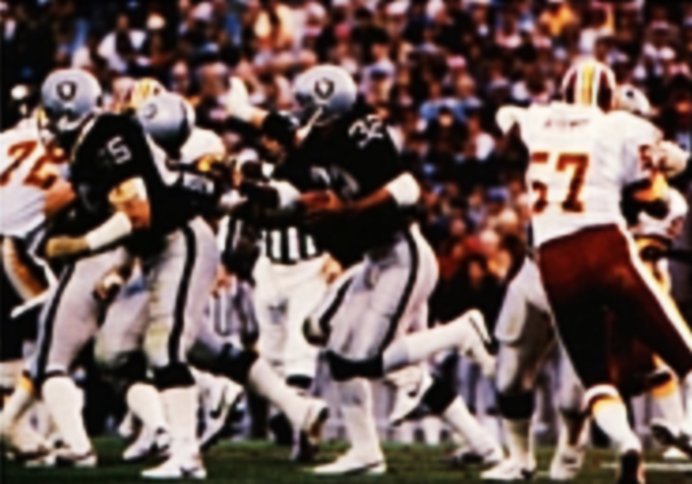 Allen (center) led the Raiders to a championship in Super Bowl XVIII