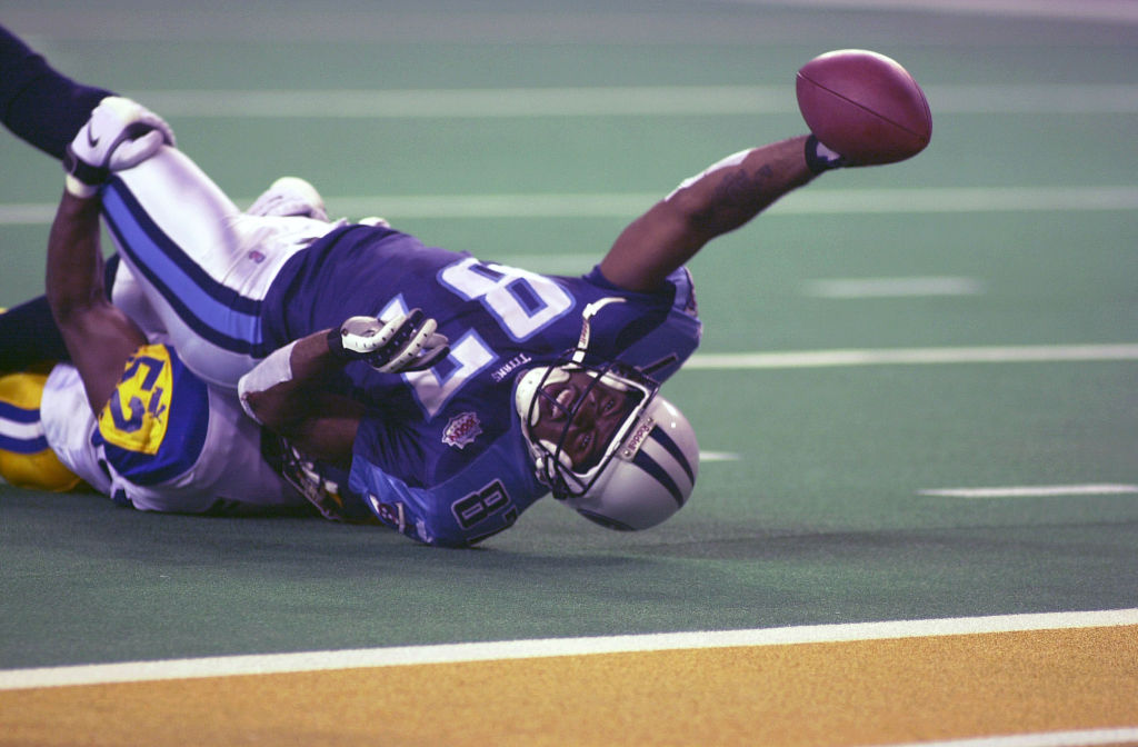 Titans wide receiver Kevin Dyson is tackled by Rams linebacker Mike Jones short of the goal line on the last play of the game
