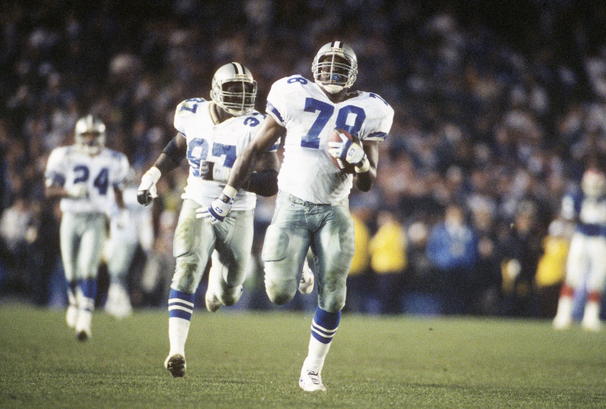 Leon Lett #78 of the Dallas Cowboys run with the ball against the Buffalo Bills