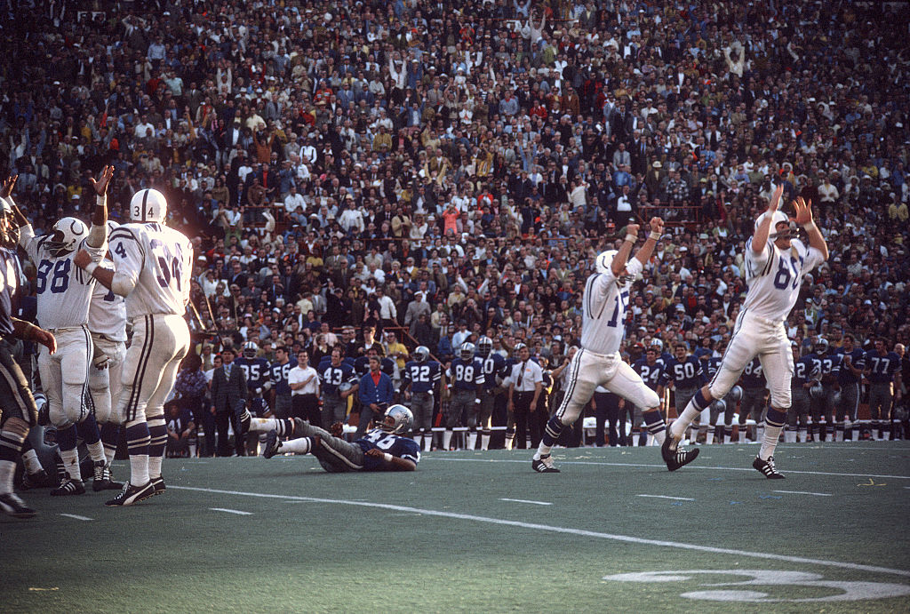 Earl Morrall #15 and Jim O'Brien #80 of the Baltimore Colts celebrates after O'Brien makes a field goal