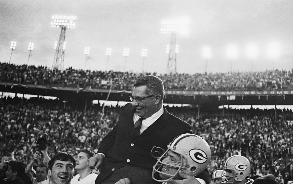 Green Bay Packers head coach Vince Lombardi gets a victory ride off the field on the shoulders of his players