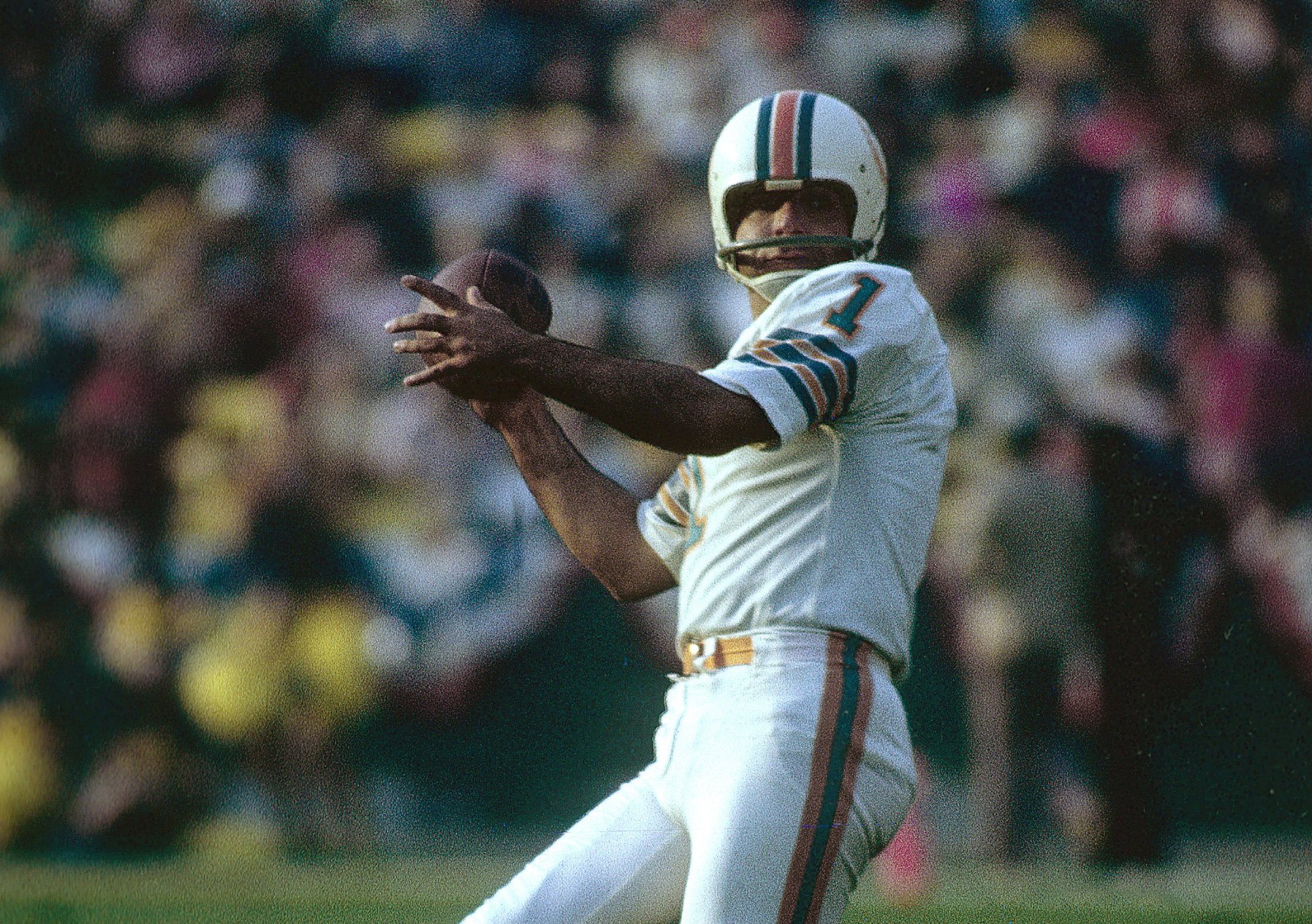Garo Yepremian #1 looks to pass the ball after a botched field goal