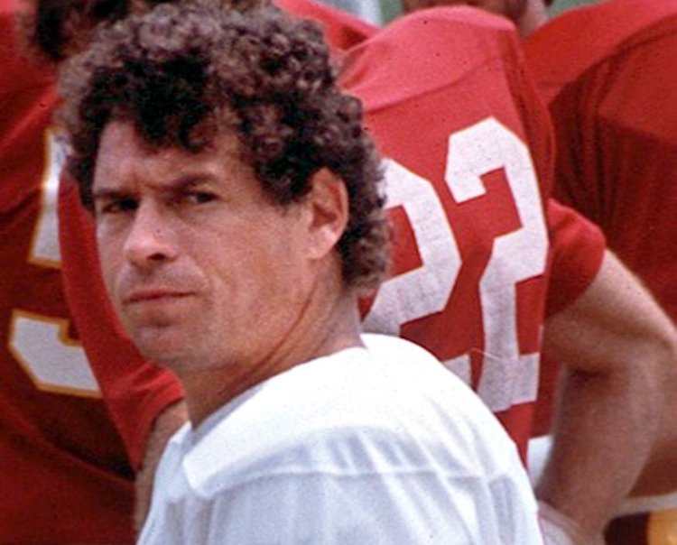 John Riggins in a white jersey