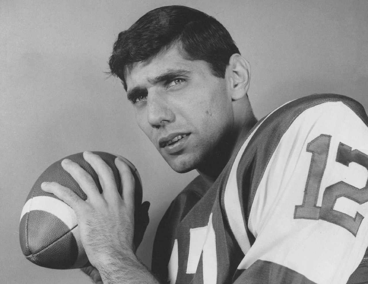 Photo of Joe Namath holding a ball