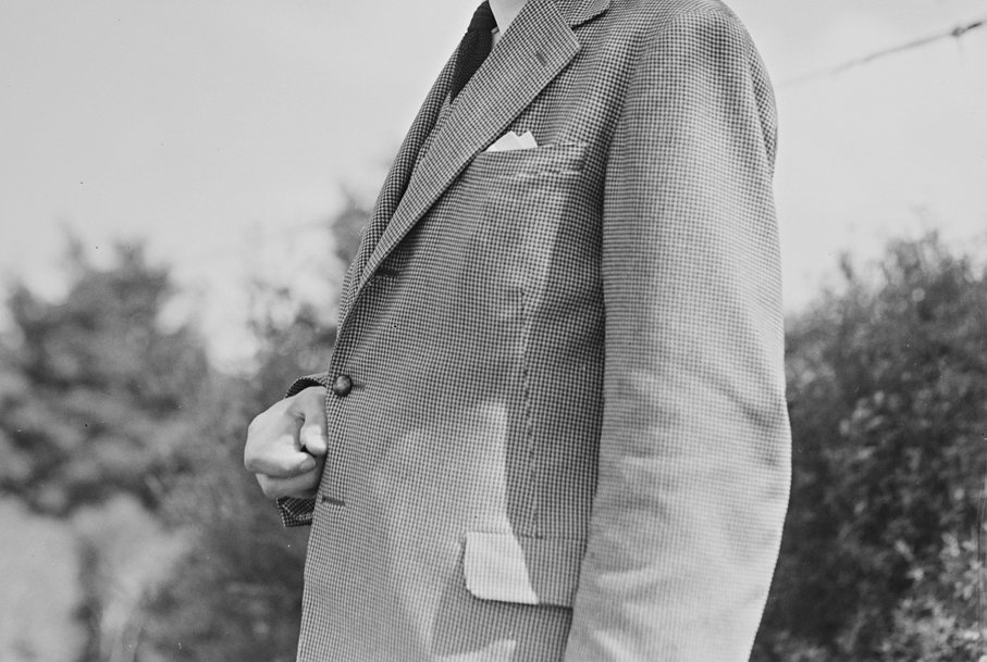 Profile of man in suit in the 1940s