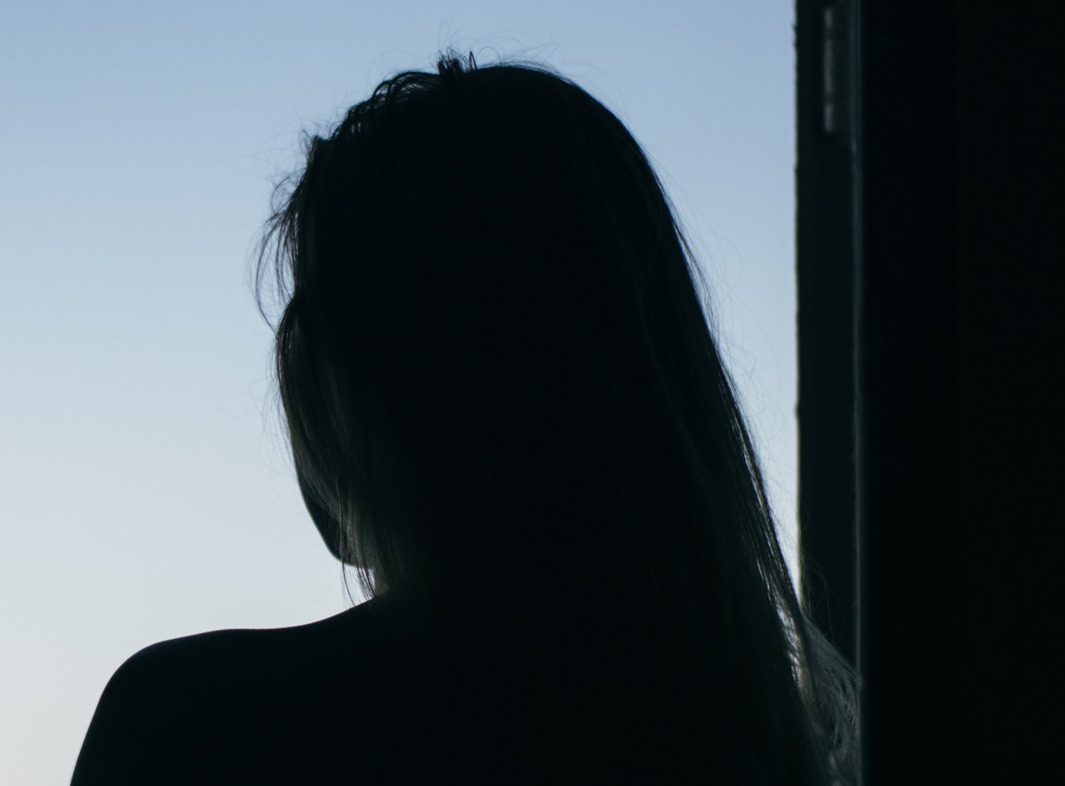 Thinking girl looking on the sea from ferry boat window