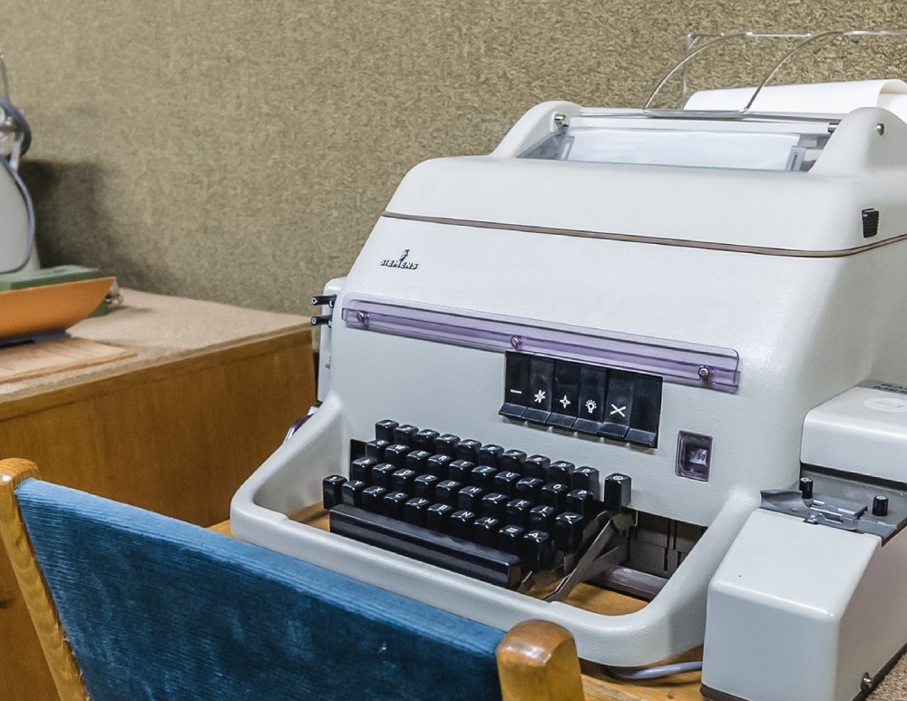 Close Up Photo of Old teletype machine placed on a table