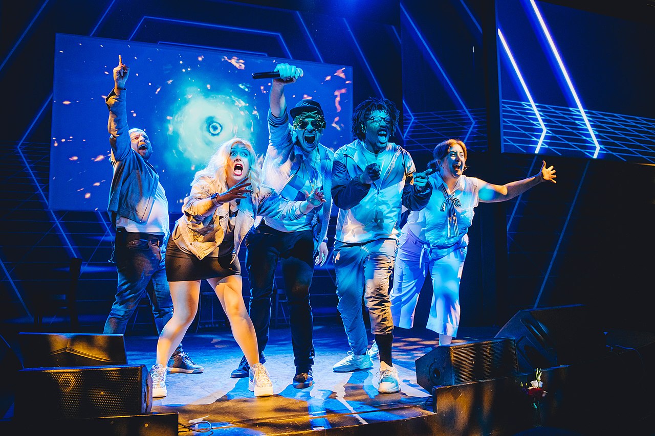 The 2022-3 Cast in Boom Chicago Into the Metaverse