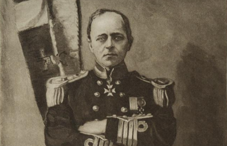 A portrait of Sir Robert Falcon Scott (1868-1912) stood, arms crossed, in uniform wearing the Royal Victorian Order