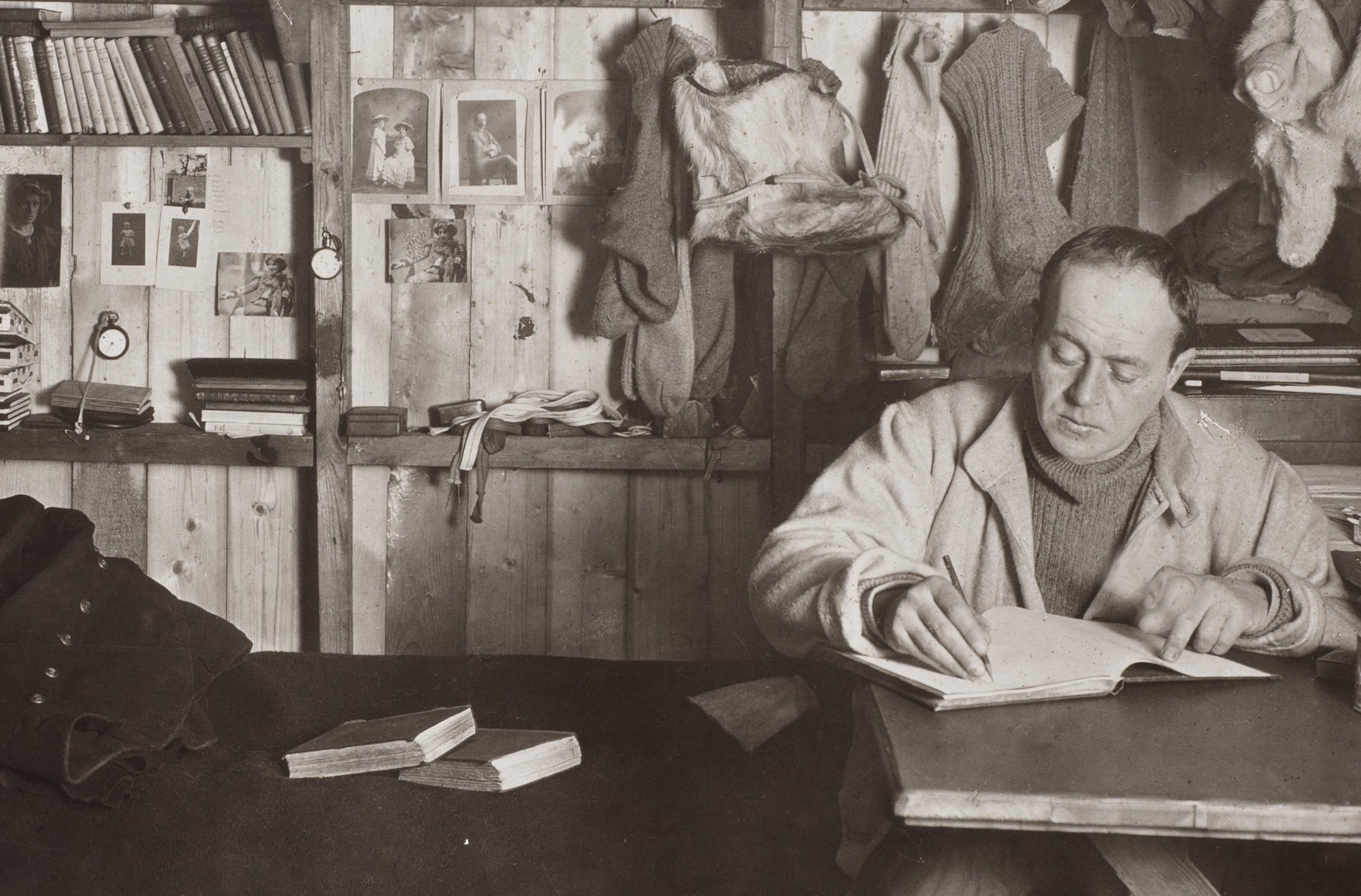 Captain Robert Falcon Scott writing in his diary, Cape Evans hut