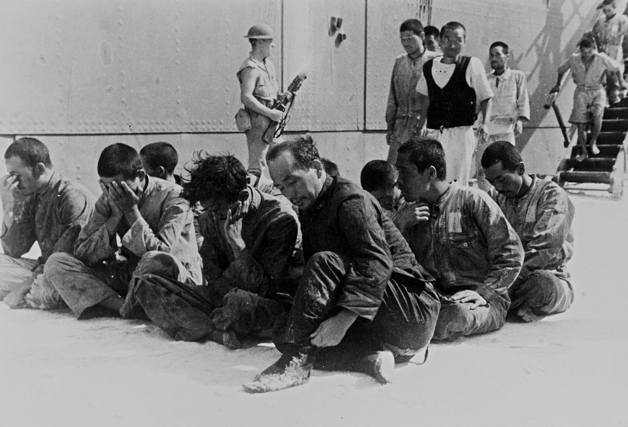 Japanese prisoners of war under guard on Midway