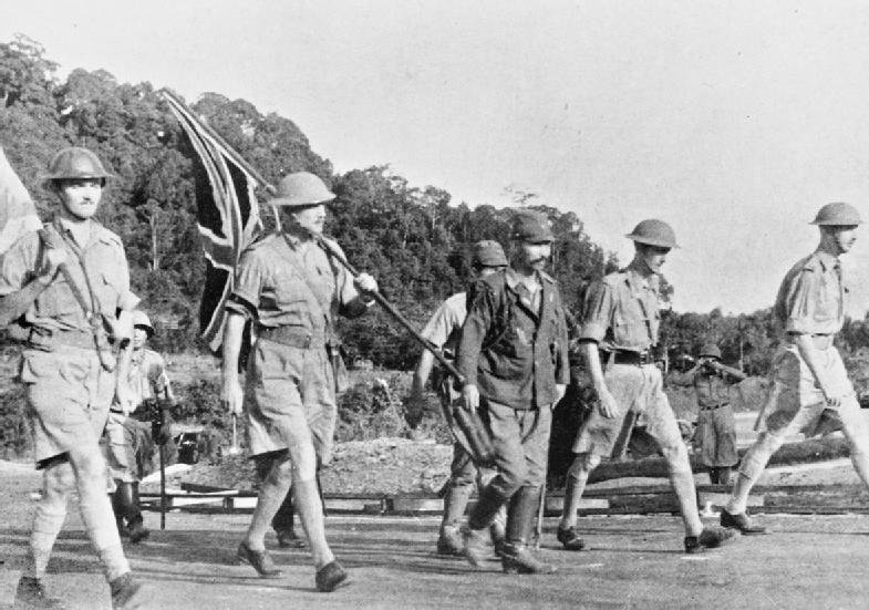 Lieutenant-General Percival and his party carry the Union flag