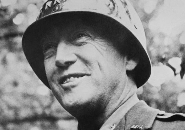 Photo of George S. Patton wearing a helmet
