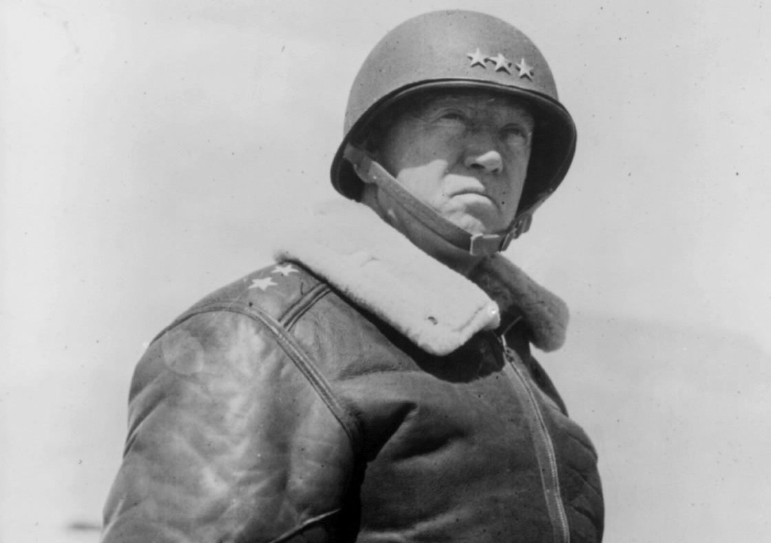 Lieutenant General George S. Patton Jr. wearing a helmet
