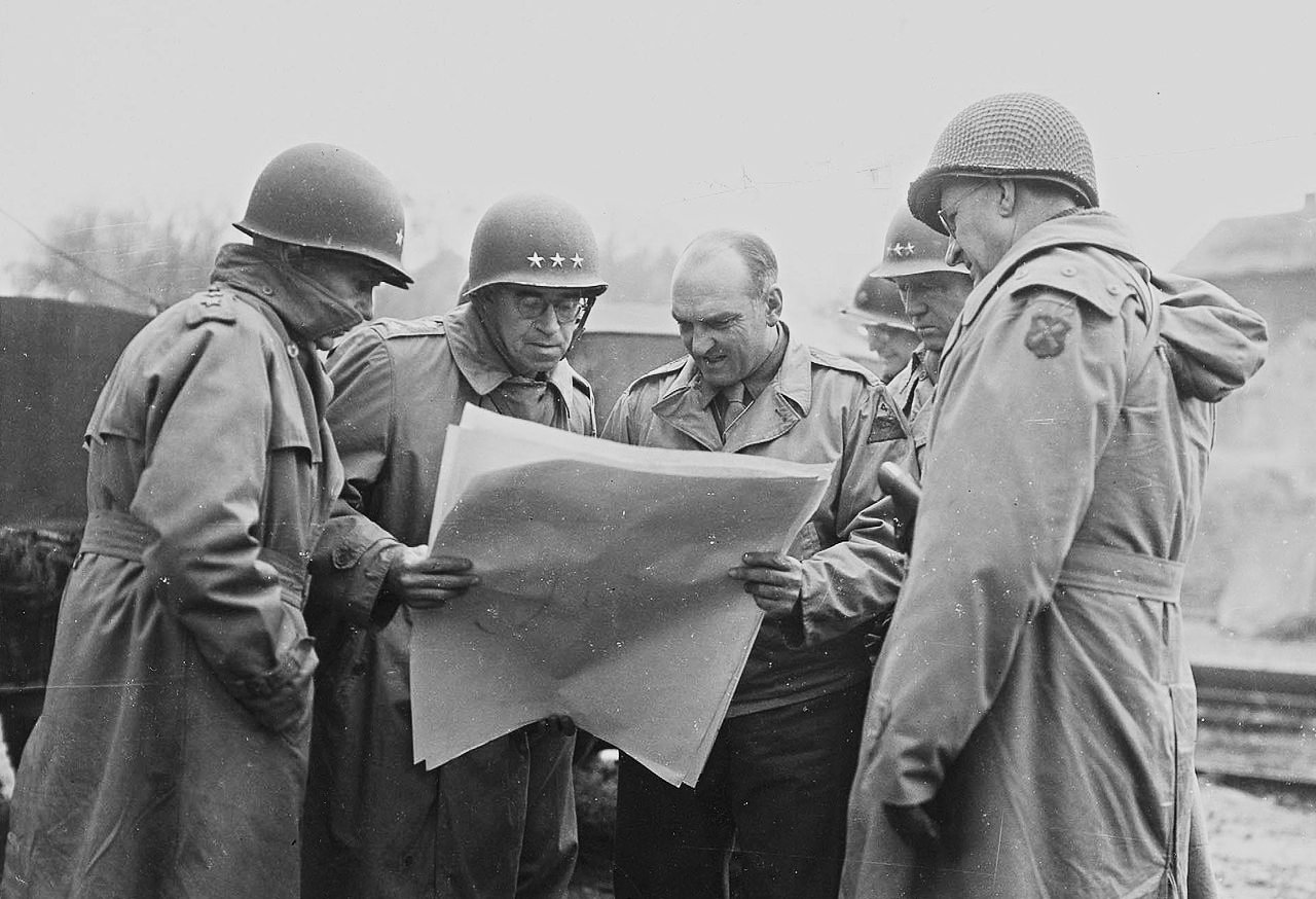 Major General Leven C. Allen, Lieutenant General Omar Bradley, Major General John S. Wood, Lieutenant General George S. Patton and Major General Manton S. Eddy