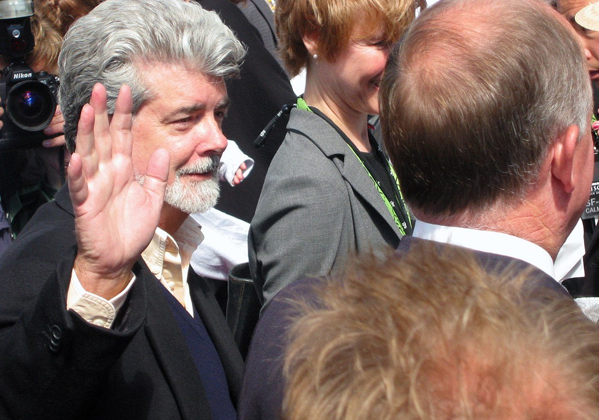 George Lucas surrounded by paparazzi
