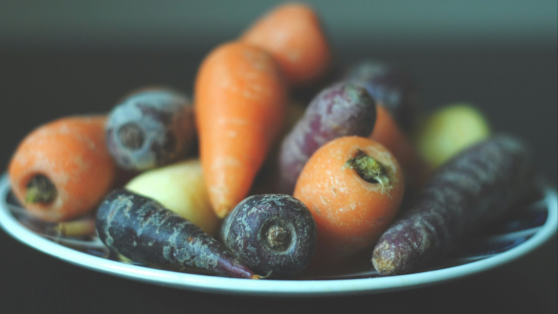 bunch of carrots on white plate