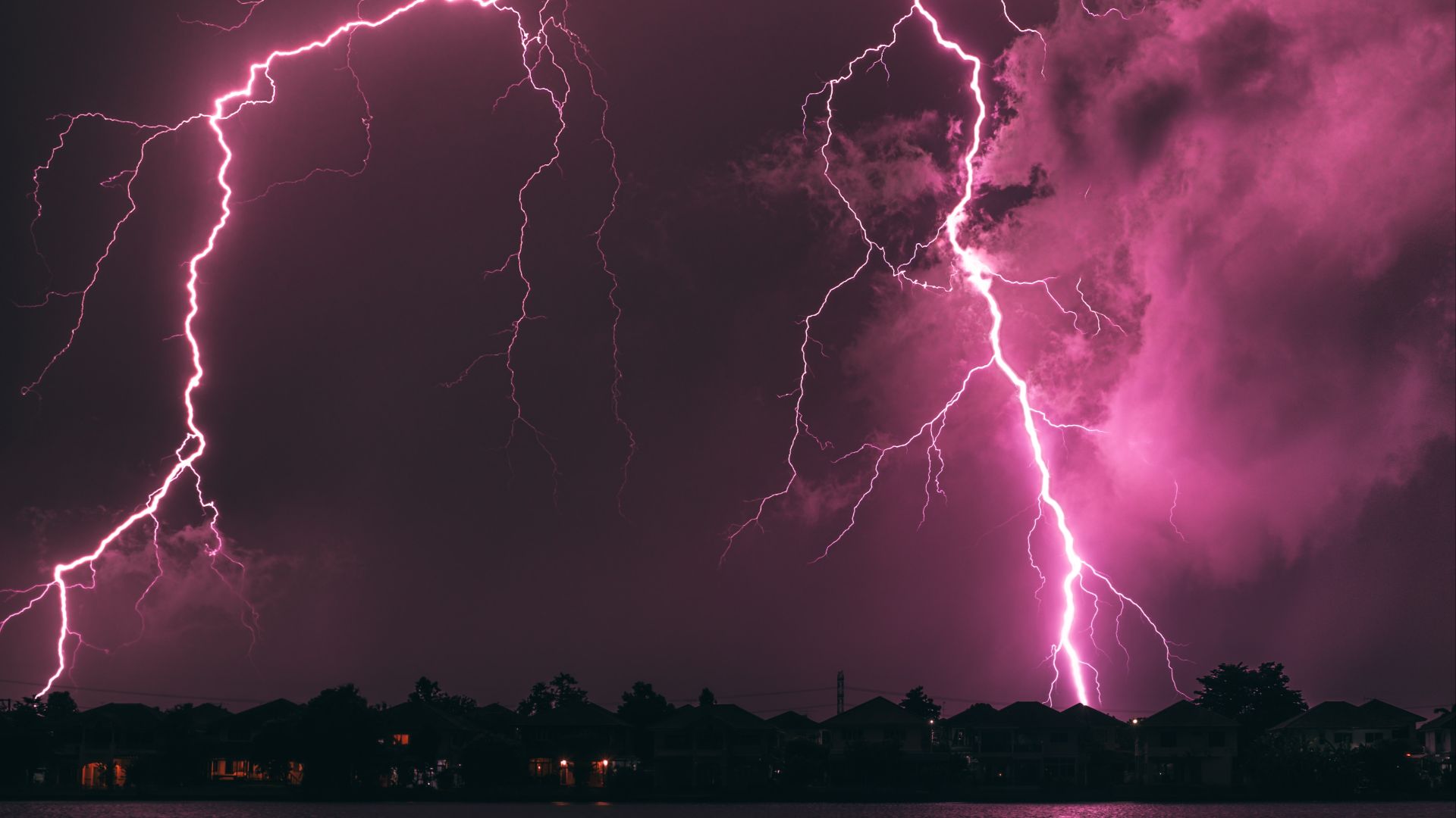 a purple sky filled with lots of lightning