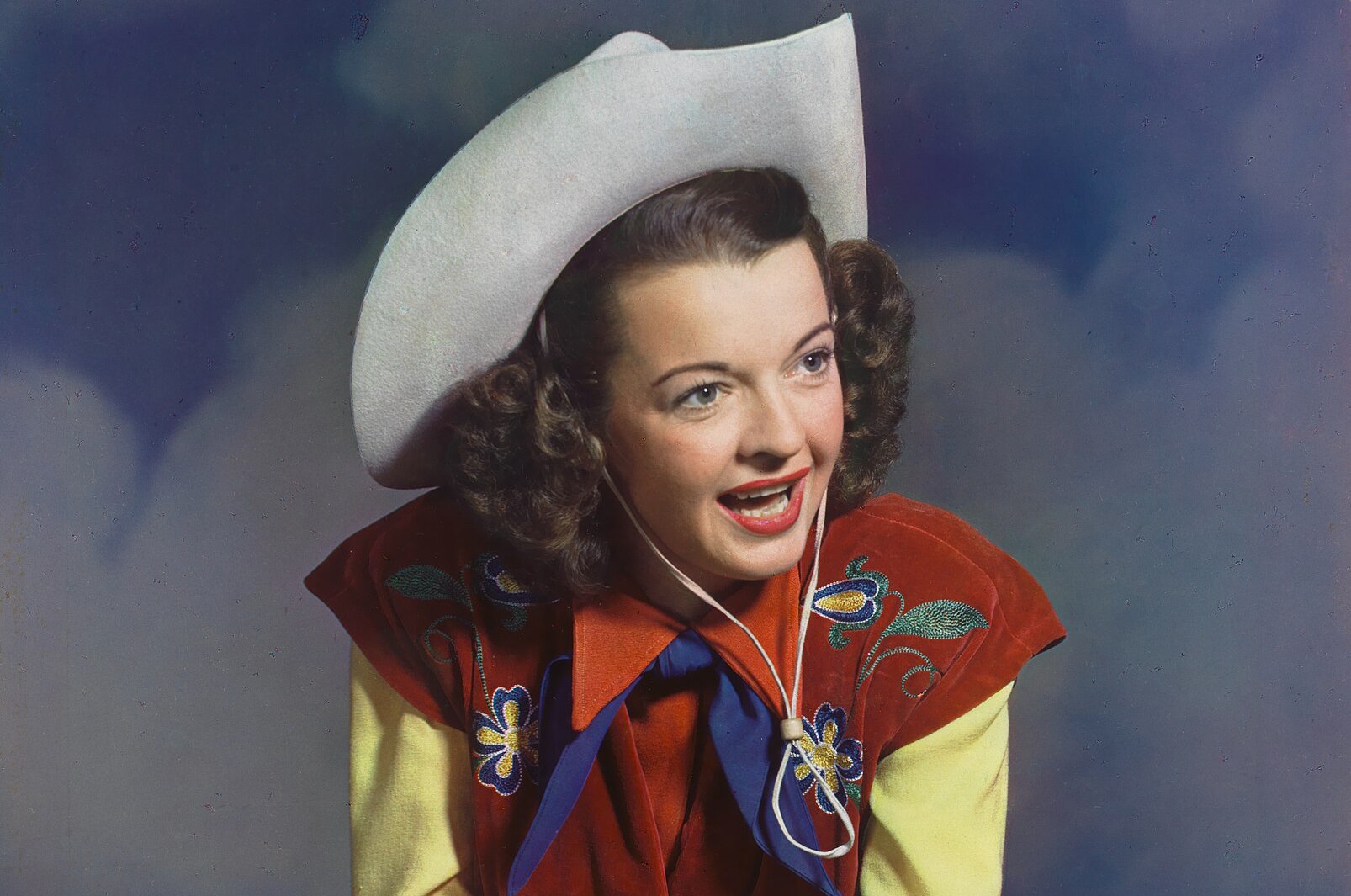 Dale Evans wearing a cowboy hat and looking away from the camera