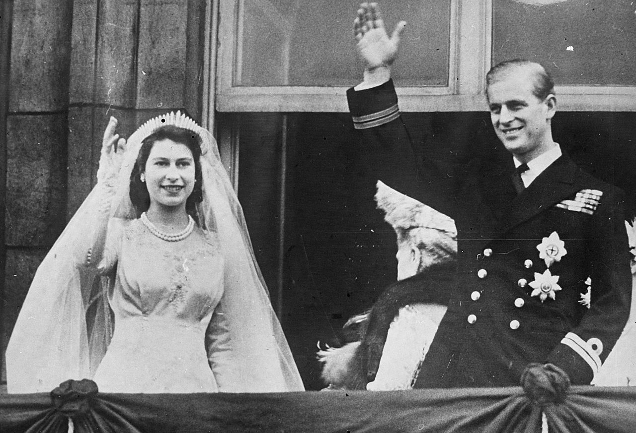 Princess Elizabeth and the Duke of Edinburgh waving to the crowds