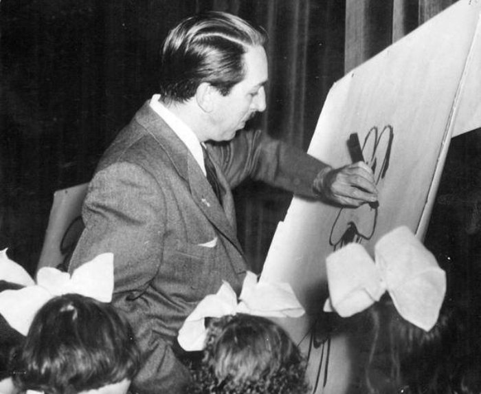 Grayscale Portrait Photo of American animator and film producer Walt Disney.