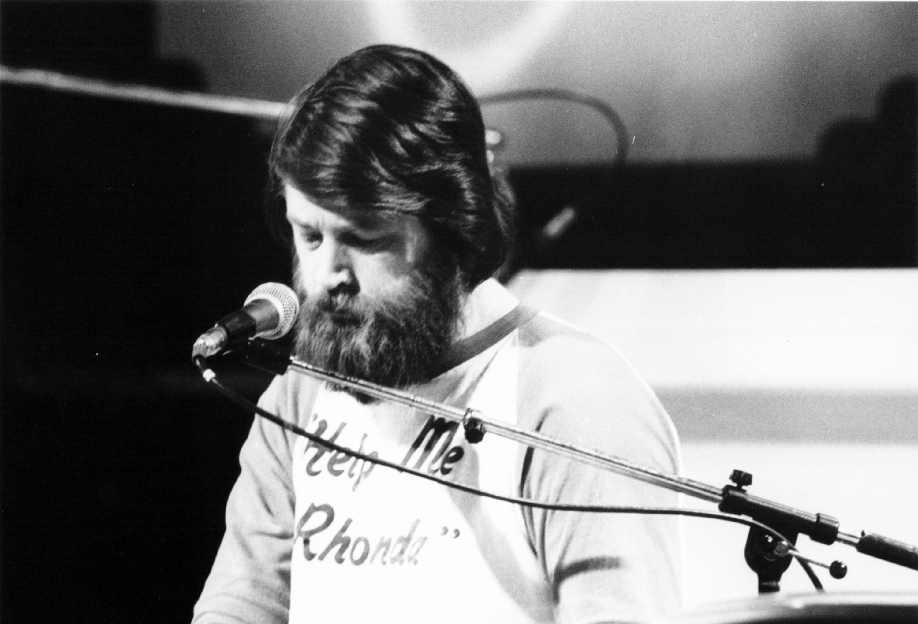 Beach Boys member Brian Wilson performing on stage