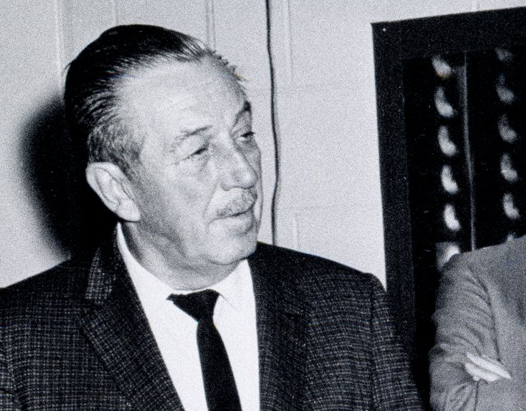 Grayscale Portrait Photo of American animator and film producer Walt Disney.