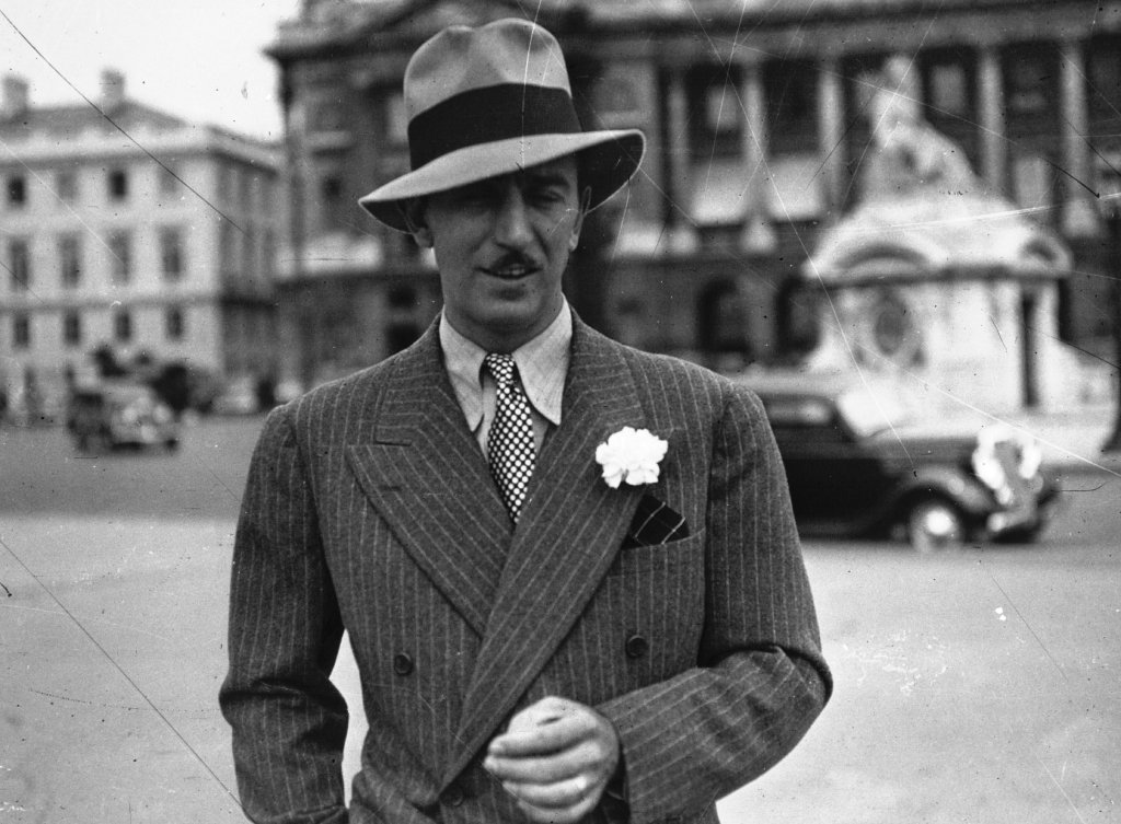 Grayscale Portrait Photo of American animator and film producer Walt Disney.