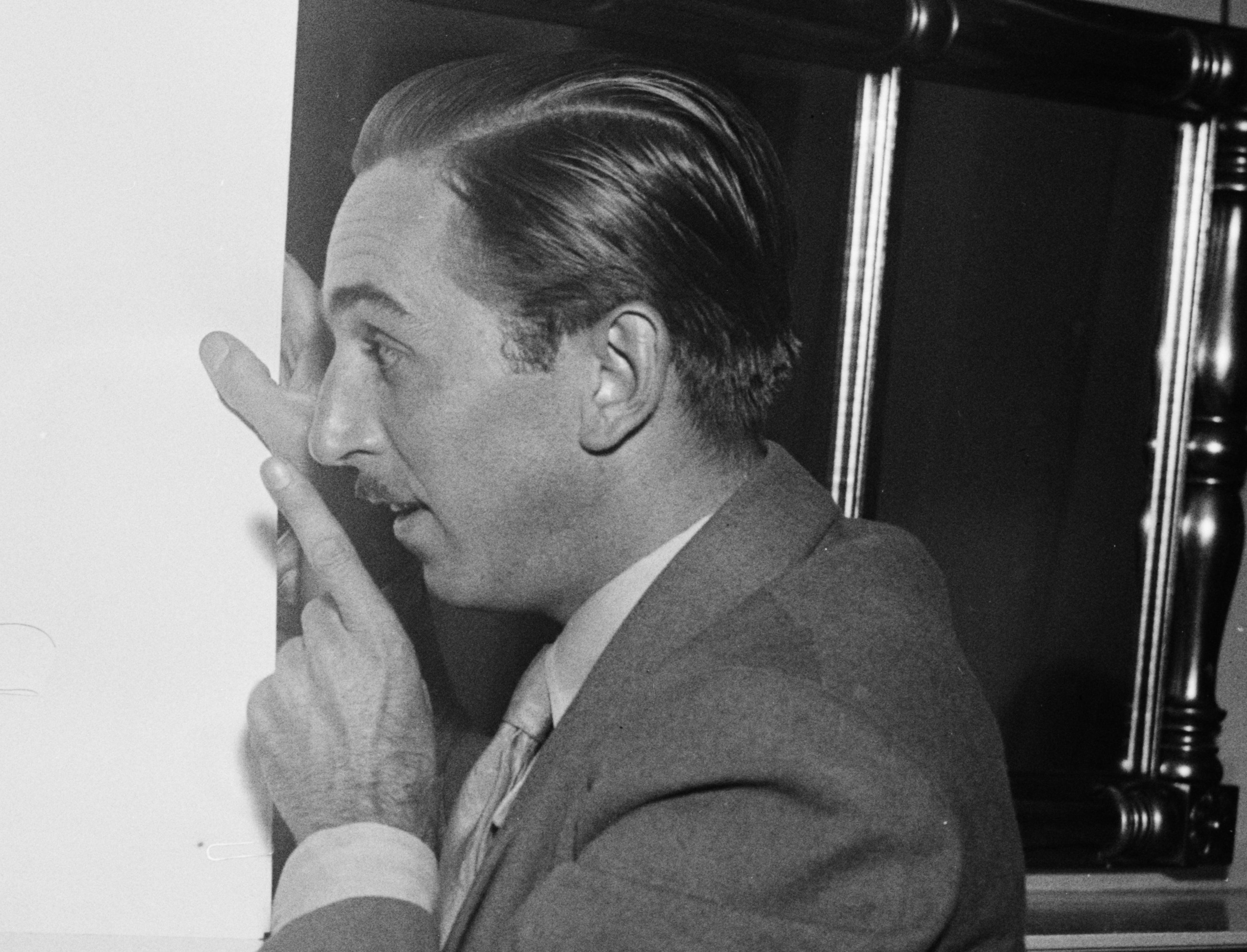 Grayscale Portrait Photo of American animator and film producer Walt Disney.