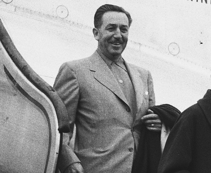 Grayscale Portrait Photo of American animator and film producer Walt Disney.