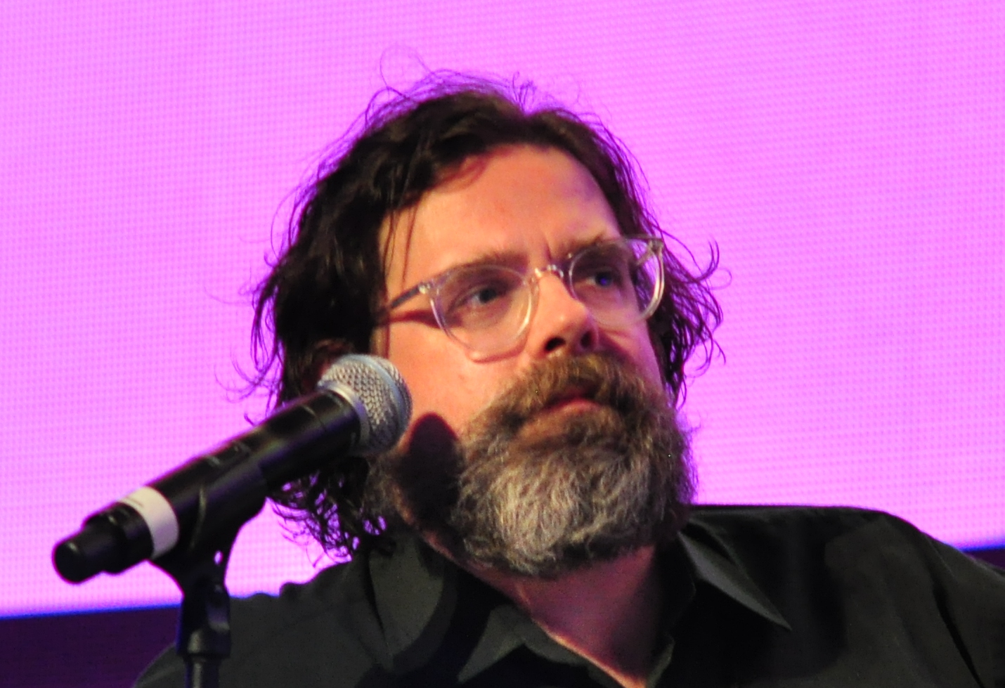 Carl Wilson wearing black shirt on the panel