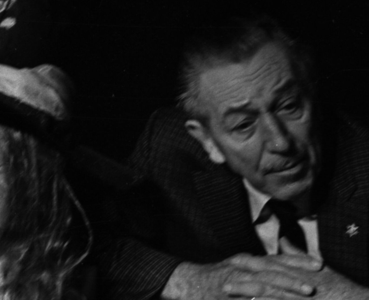 Grayscale Portrait Photo of American animator and film producer Walt Disney.