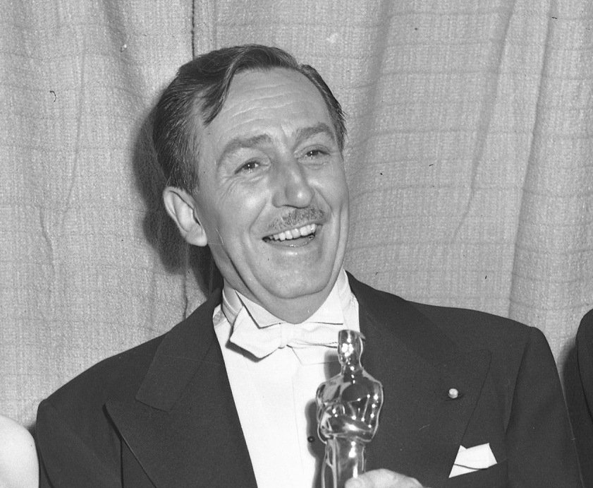 Grayscale Portrait Photo of American animator and film producer Walt Disney.