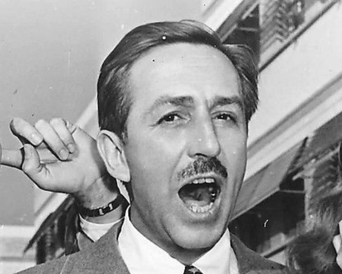 Grayscale Portrait Photo of American animator and film producer Walt Disney.