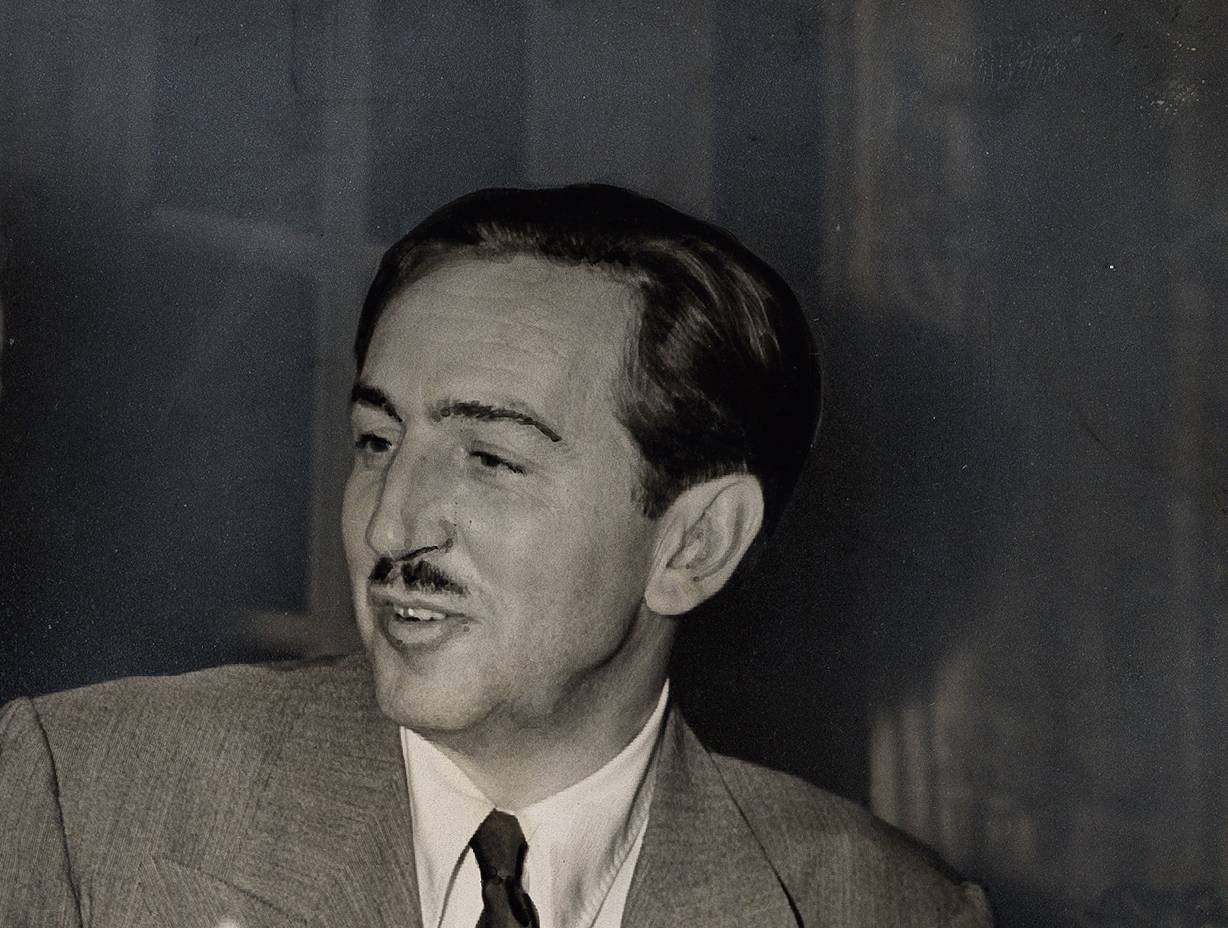 Grayscale Portrait Photo of American animator and film producer Walt Disney.