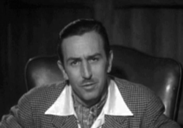 Grayscale Portrait Photo of American animator and film producer Walt Disney.