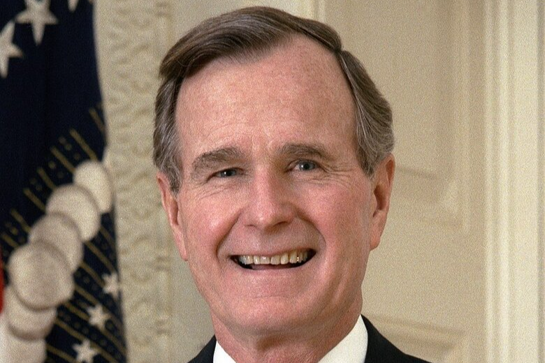 Portrait Photo of U.S. President George H. W. Bush in a dark blue suit