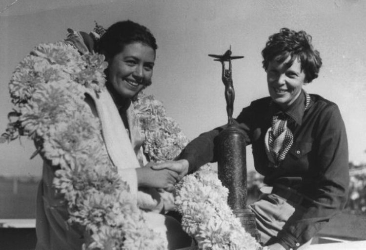 Amelia Earhart with trophy