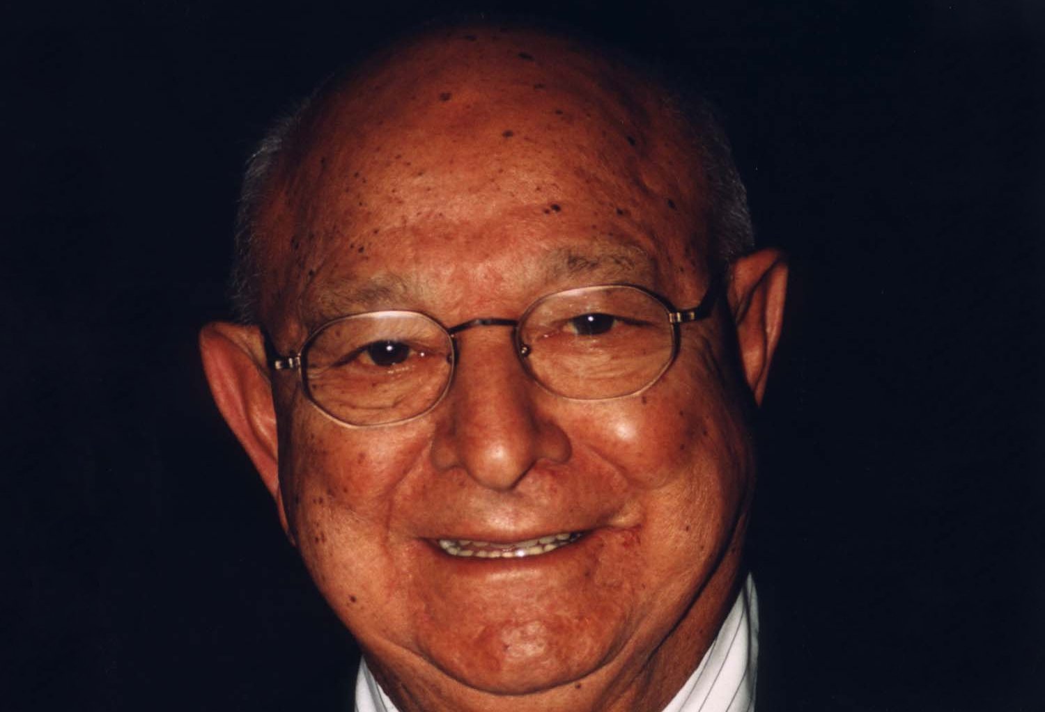 Angelo Dundee wearing a pair of glasses
